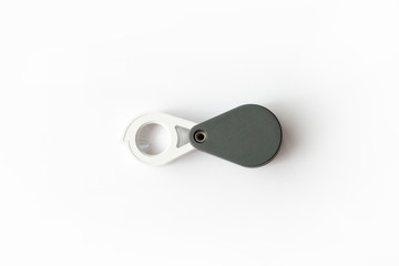 Magnifying glass for diamonds or see the amulet Isolated on a White Background.