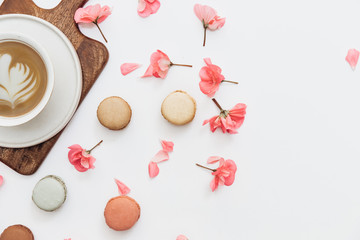 Stylish feminine composition,  table desk. coffee and macaroons on white background.  Minimal lifestyle concept Flat composition for magazines, websites, media, Instagram. Flat lay, top view - Image