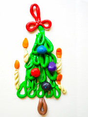 children's crafts Christmas tree with candles and balls of plasticine