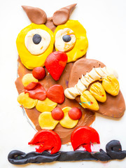 child's drawing. owl drawing by plasticine, artistic painting bird, cute fluffy nestling