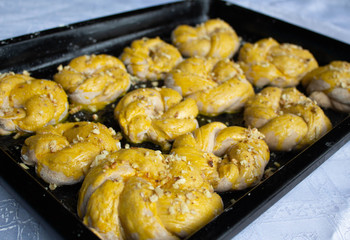 Homemade tasty buns with nut sprinkle.Pastry with homemade pastries. Baking homemade cookies and muffins with nuts. 