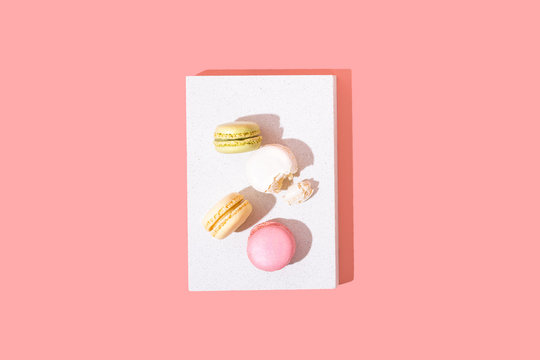 Colorful Macarons or Macaroons on Bright Background, Minimal Top View Flat Lay