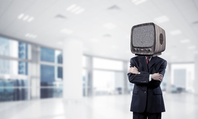 Businessman with old TV instead of head.