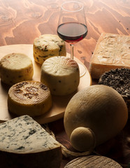 italian cheeses on the wooden table
