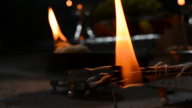 Closeup of burning pooja Aarti sticks(The Hindu Ceremony of Light) in the temple during a navaratri festival.