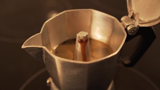 Brewing espresso coffee in moka pot - faster motion, closeup