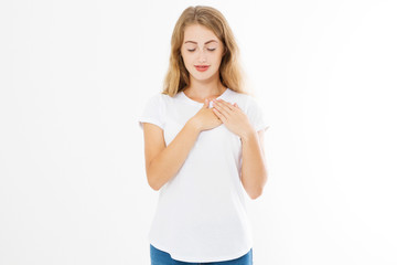 Girl touching her heart. Healthy life style living. Love romance and body language. Smiling happy woman face and template white t shirt with copy space isolated on white background. Summer time