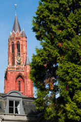 Fototapeta premium red orange tower of church, Sint Janskerk in Maastricht, The Netherlands