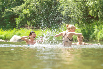 Women swimming and splashing in the water