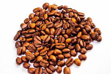 Roasted coffee beans in a glass cup isolated on a white background