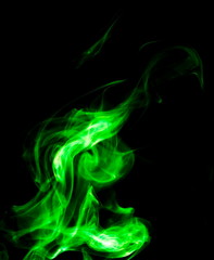 Obraz premium Green smoke on black background