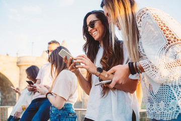 Group of friends watching media on a smartphone