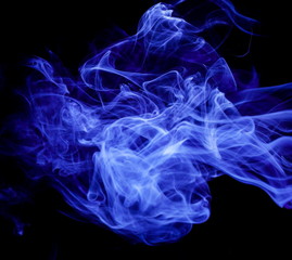 Blue smoke on black background