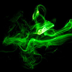 Green smoke on black background