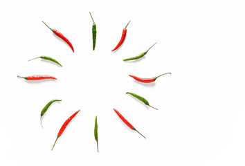 small chili red and green peppers on white background