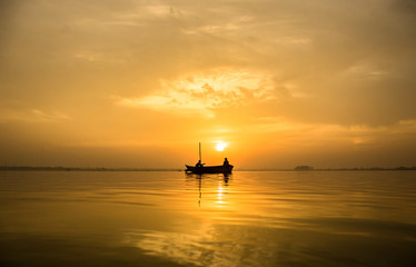 a boat with sunrise