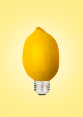Introducing new natural energy. An alternative lamp. Juicy idea and sour emotions. Yellow lemon or citrus as a light source against soft background. Modern design. Contemporary art collage.