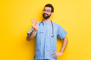 Surgeon doctor man happy and counting three with fingers