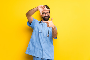 Surgeon doctor man focusing face. Framing symbol