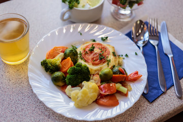 chop with vegetables and juice in a cafe