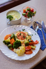 chop with vegetables and juice in a cafe