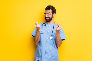 Surgeon doctor man making money gesture