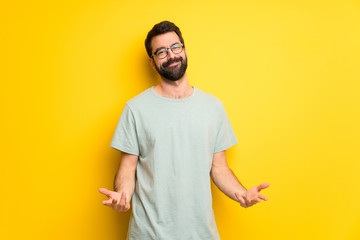 Man with beard and green shirt smiling