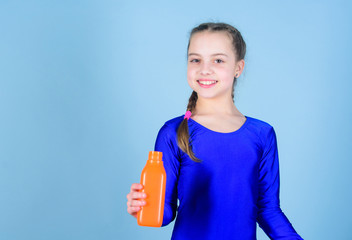 Quench thirst. Child feel thirst after sport training. Kid cute girl gymnast sports leotard hold...