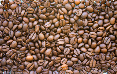 Roasted arabica coffee beans closeup background. Texture