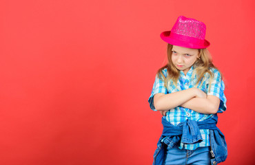 Cool cutie fashionable outfit. Happy childhood. Kids fashion concept. Check out my fashion style. Fashion trend. Feeling awesome in this hat. Girl cute kid wear fashionable hat. Small fashionista