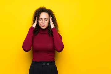 Dominican woman with turtleneck sweater unhappy and frustrated with something