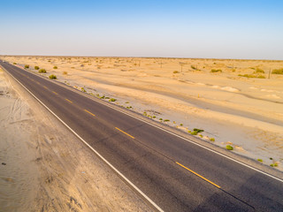 aerial view of highway on the gobi desert xinjiang， 