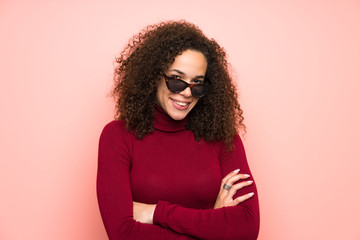 Dominican woman with turtleneck sweater laughing