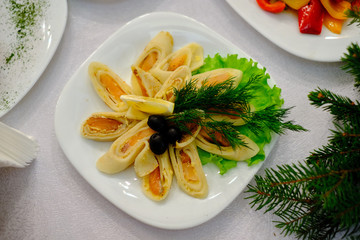 red fish in pancakes with vegetables