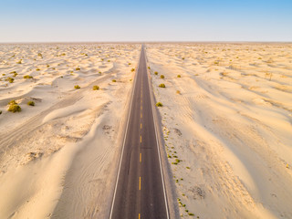 aerial view of highway on the gobi desert xinjiang， 