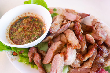 roasted pork grilled meat slice and spicy sauce thai style food