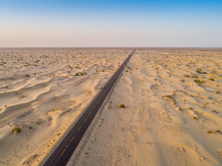 aerial view of highway on the gobi desert xinjiang， 