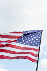 national flag of america with stars and stripes against sky