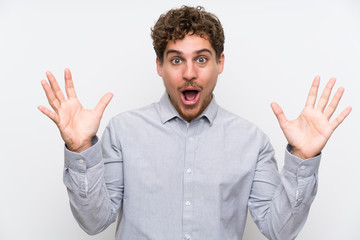 Fototapeta premium Blonde man over isolated white wall with surprise facial expression