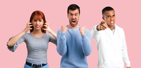 Group of three friends annoyed angry in furious gesture