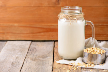 Vegan non dairy  oat milk  in a jar with copy space