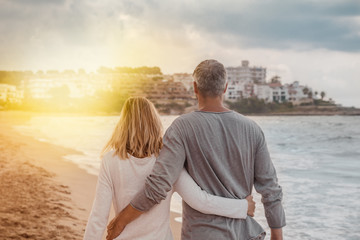 walking coastline couple