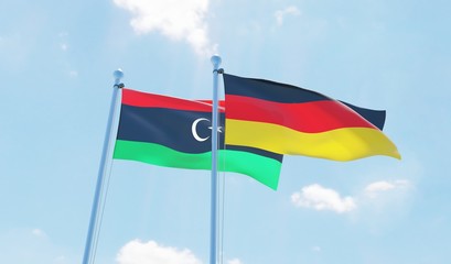 Germany and Libya, two flags waving against blue sky. 3d image