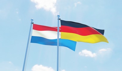 Germany and Netherlands, two flags waving against blue sky. 3d image