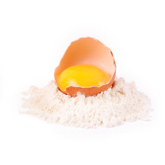 Pile of flour and egg isolated on white background