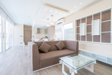 real estate , luxury interior design in living room of pool villas. Airy and bright space with high raised ceiling and dining table