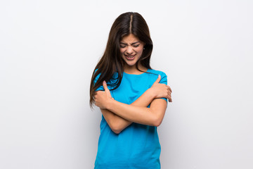 Teenager girl with blue shirt freezing