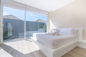real Luxury Interior design in bedroom of pool villa with cozy king bed with high raised ceiling home, house ,building