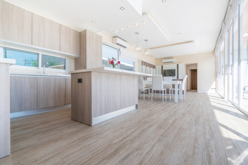 house or home building Luxury interior design in living room of pool villas. Airy and bright space with high raised ceiling and wooden dining table