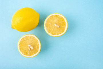 Fresh yellow lemon on a light blue background